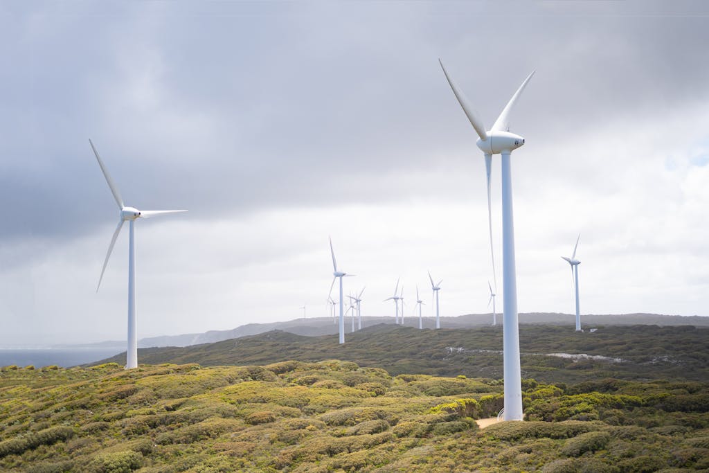 Photo Of Wind Turbines Under Cloudy Sky